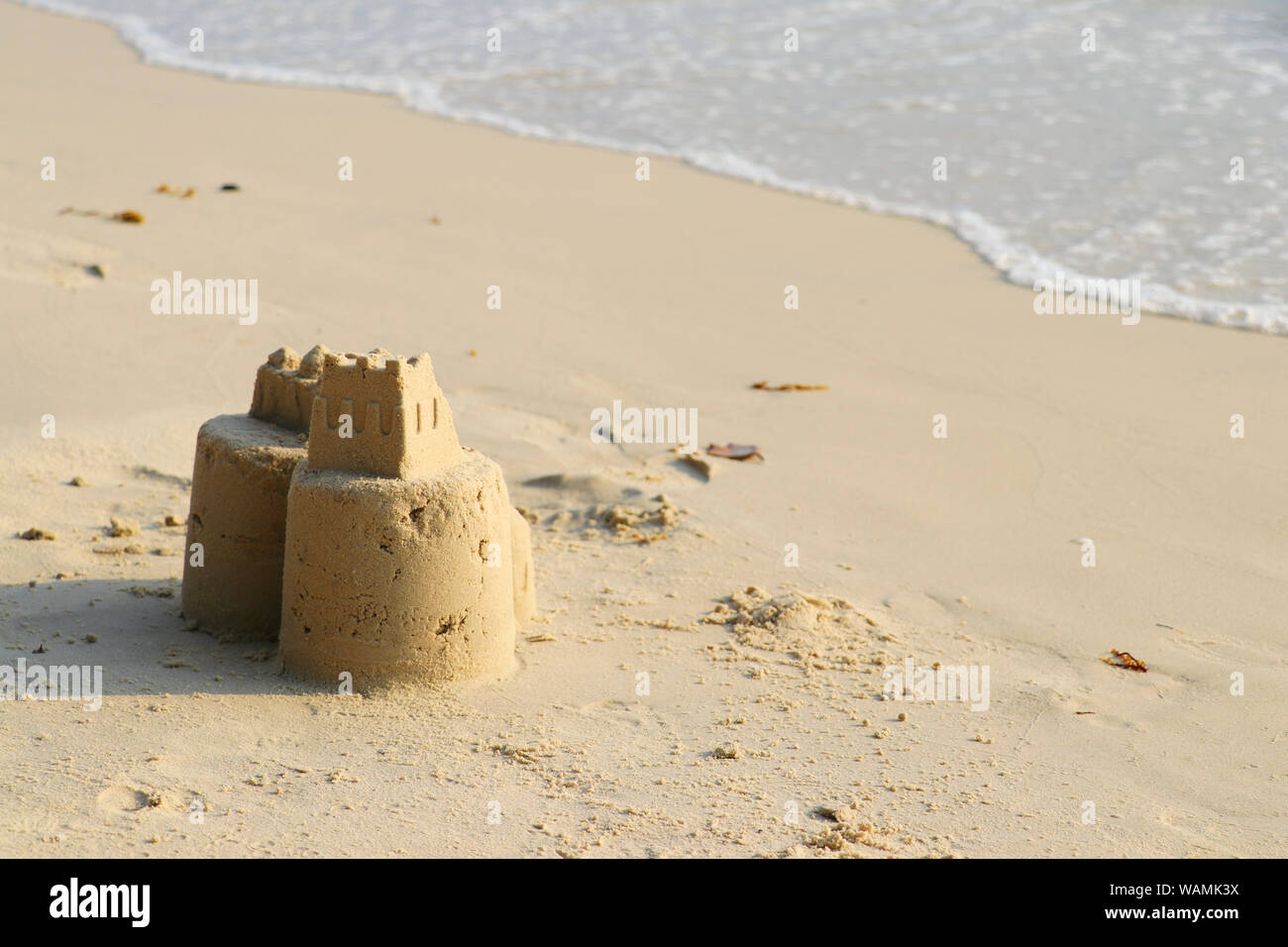 Sand castle on the beach. Children build sand castles on the beach