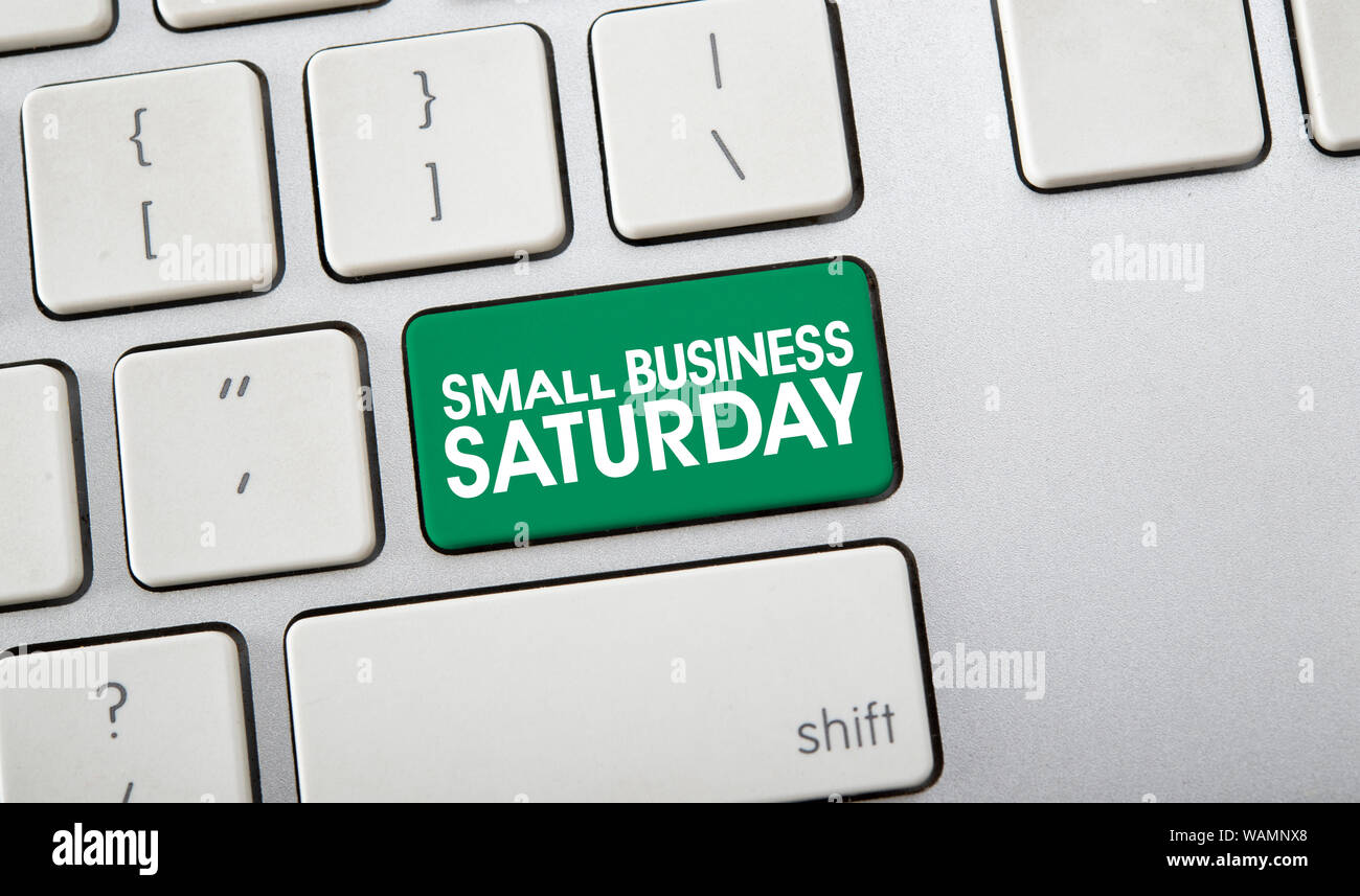 Text of Small Business Saturday on computer keyboard, American shopping holiday Stock Photo