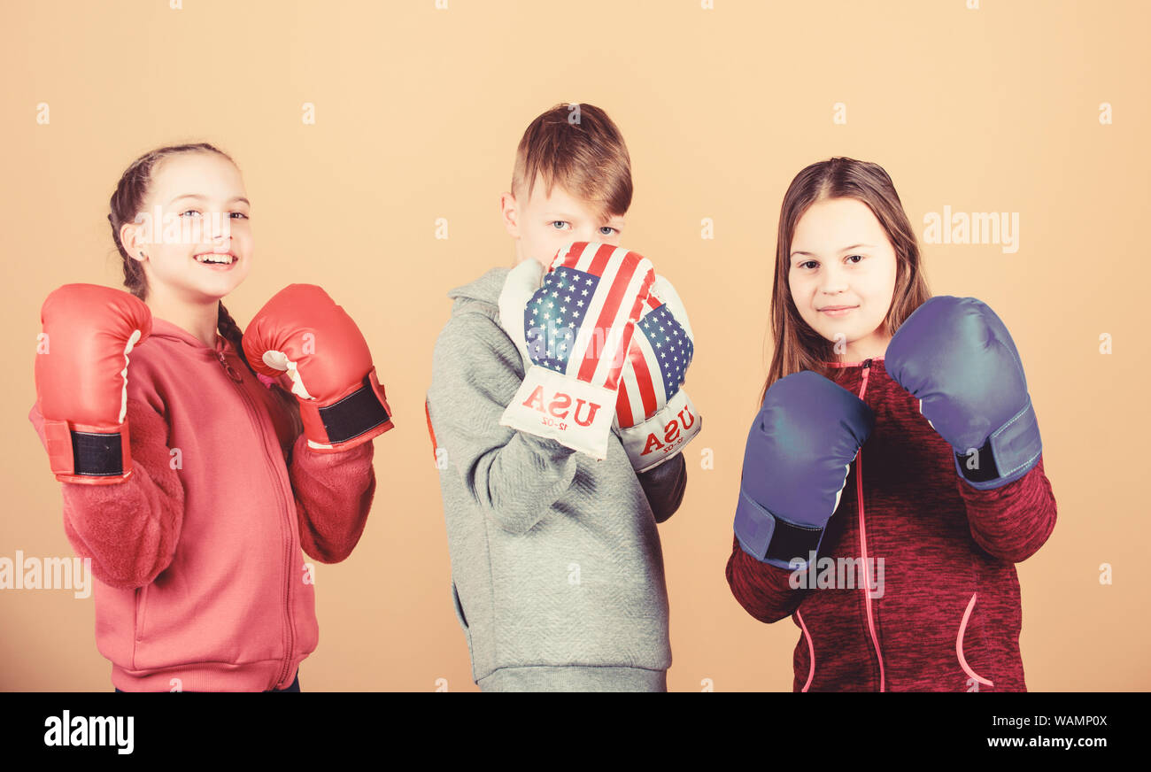 Friendly sparring. Boy and girls friends wear boxing gloves with usa