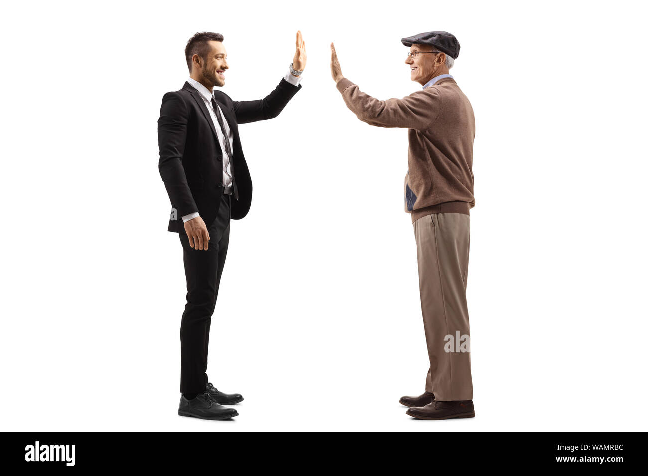 Full length profile shot of a businessman gesturing high-five with a senior man isolated on white background Stock Photo