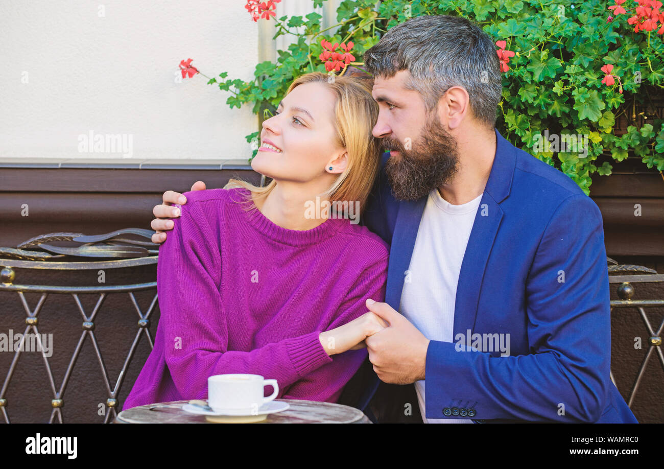 Couple cuddling cafe terrace. Couple in love sit cafe terrace enjoy ...