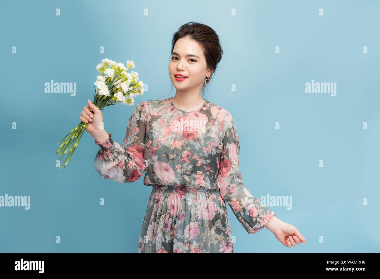 Beautiful elegant woman wearing flower dress Stock Photo - Alamy