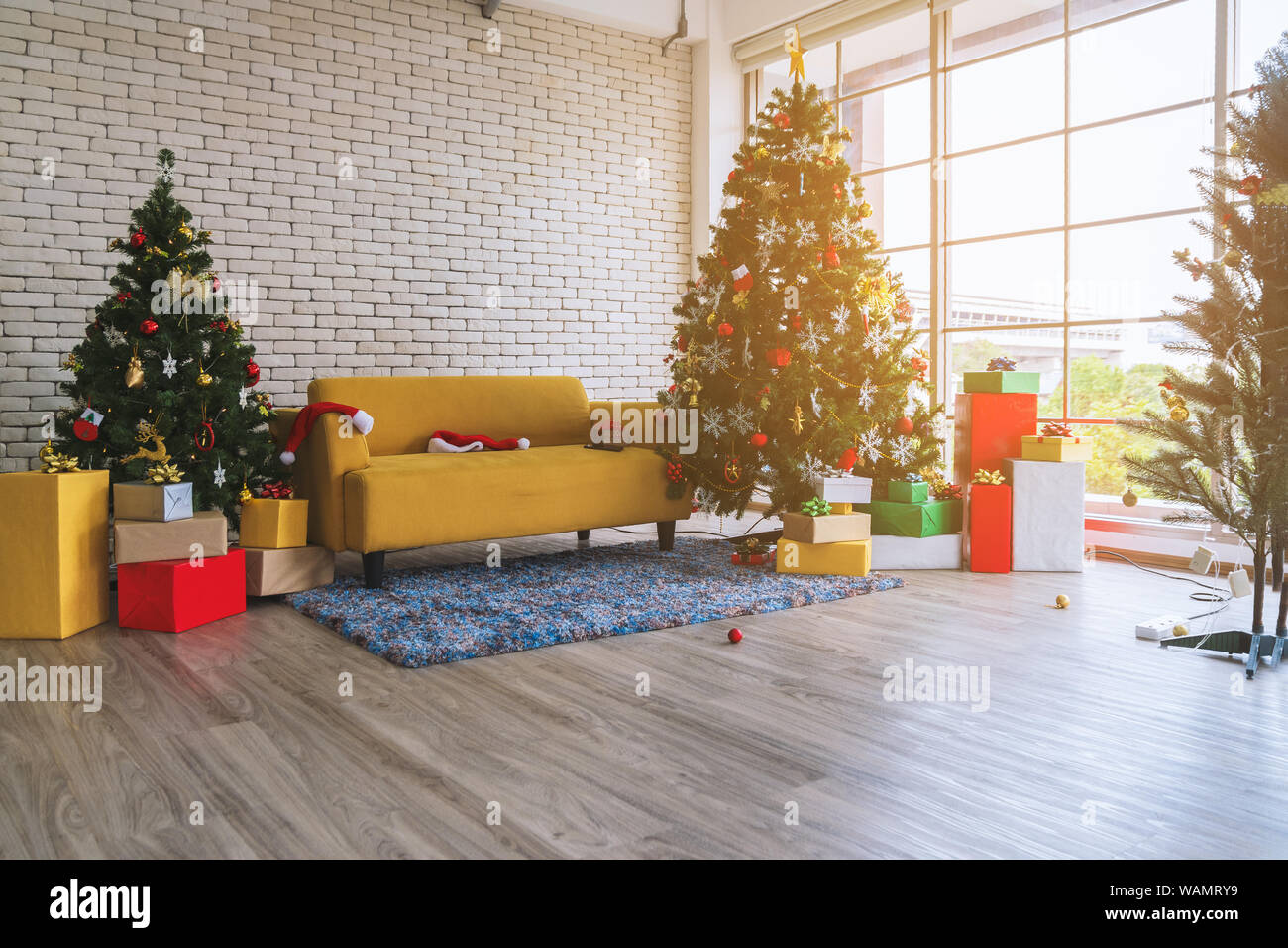 Interior living room with a christmas tree and decorations in daytime ...