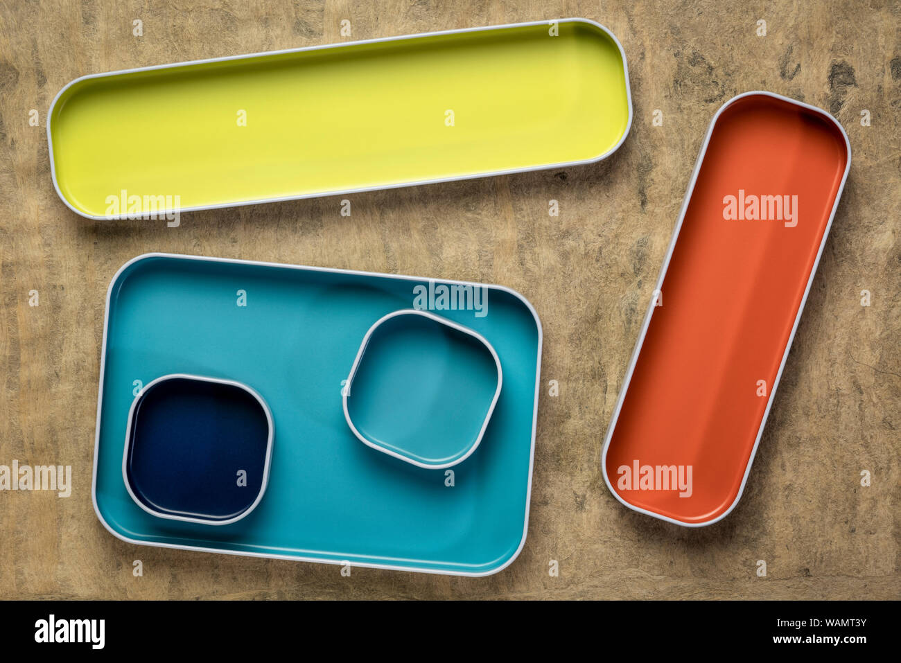 Top View Of Colorful Drawer Organizer Bins Against Textured Bark