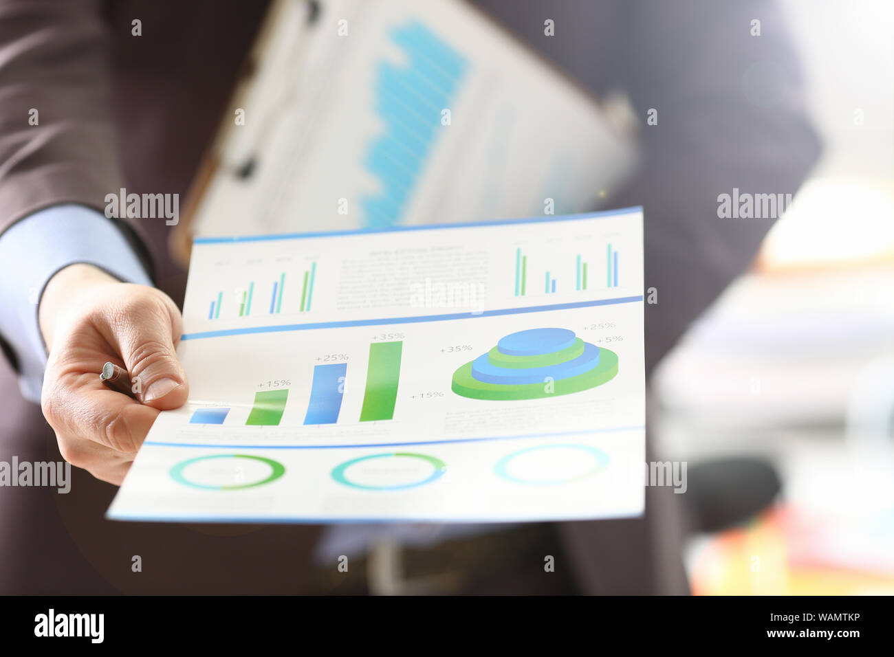 Person Analyzing Business Proceeds Using Graph Stock Photo