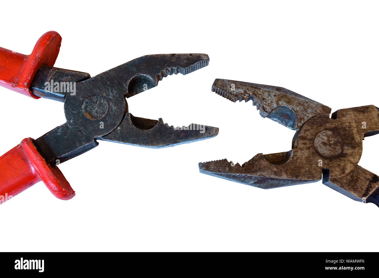 two used rusty worn pliers biting each other on a white background Stock Photo