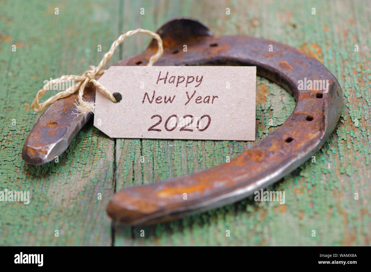 Happy new year 2020 with rusty horse shoe Stock Photo
