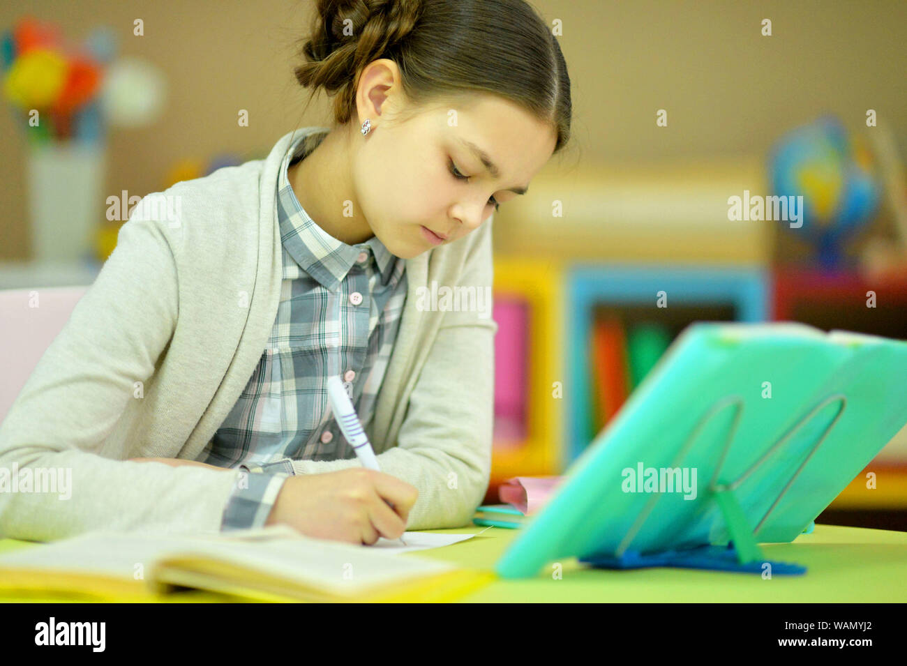 Cute beautiful little girl studying in the room at home Stock Photo - Alamy