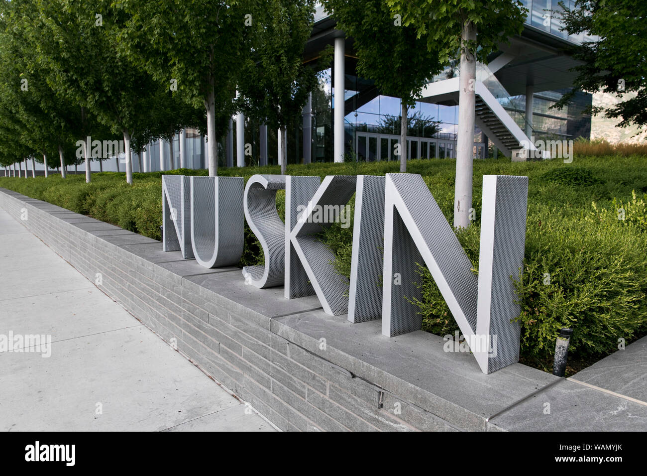 A logo sign outside of the headquarters of Nu Skin Enterprises in Provo, Utah on July 29, 2019. Stock Photo