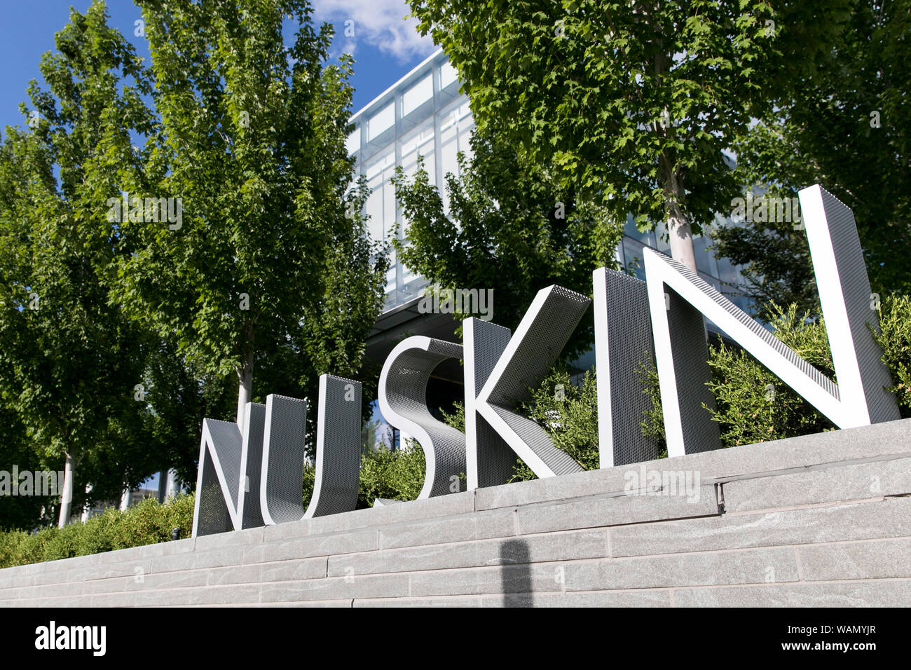 A logo sign outside of the headquarters of Nu Skin Enterprises in Provo, Utah on July 29, 2019. Stock Photo