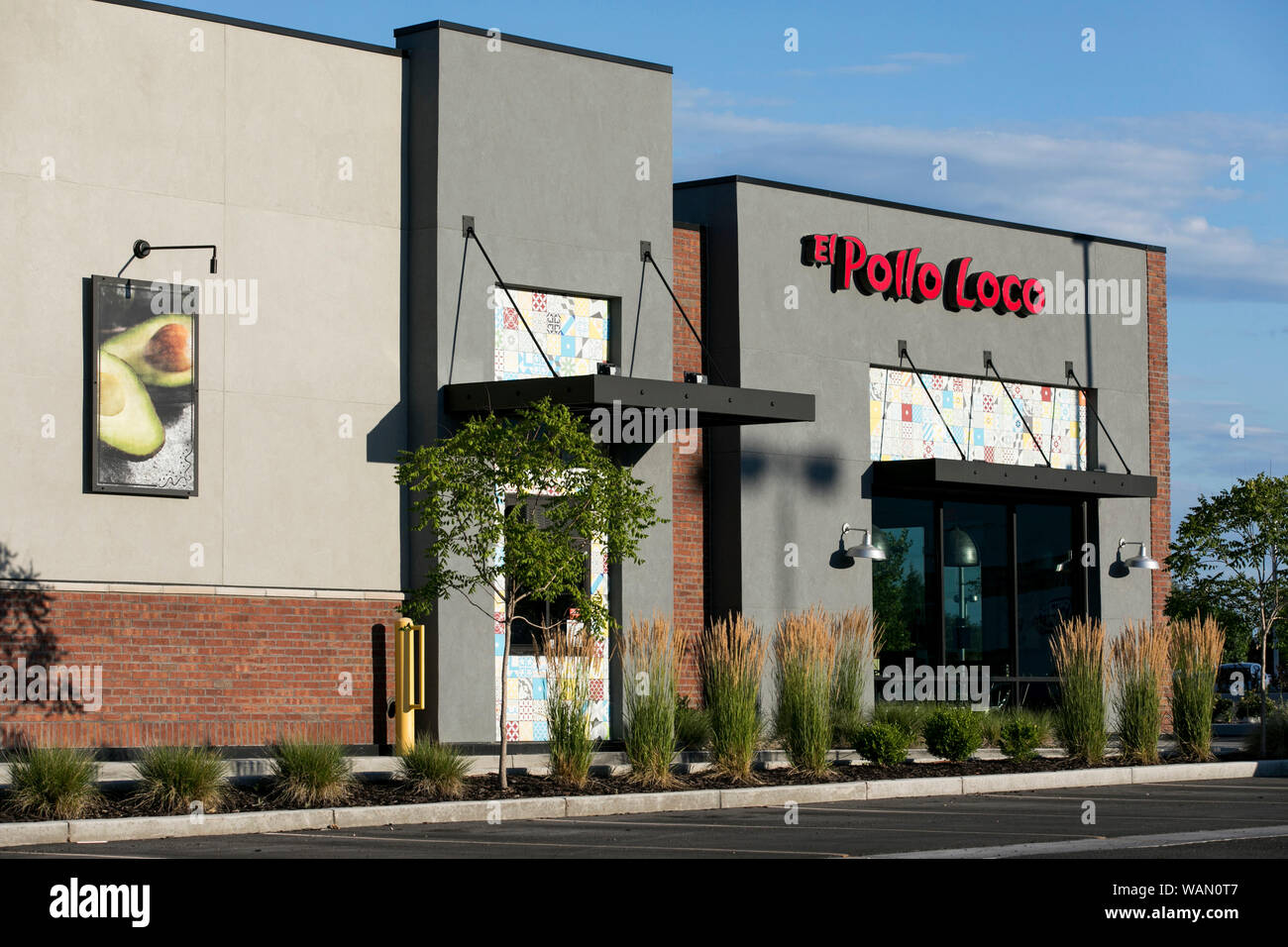 A logo sign outside of a El Pollo Loco fast food restaurant location in Orem, Utah on July 29, 2019. Stock Photo