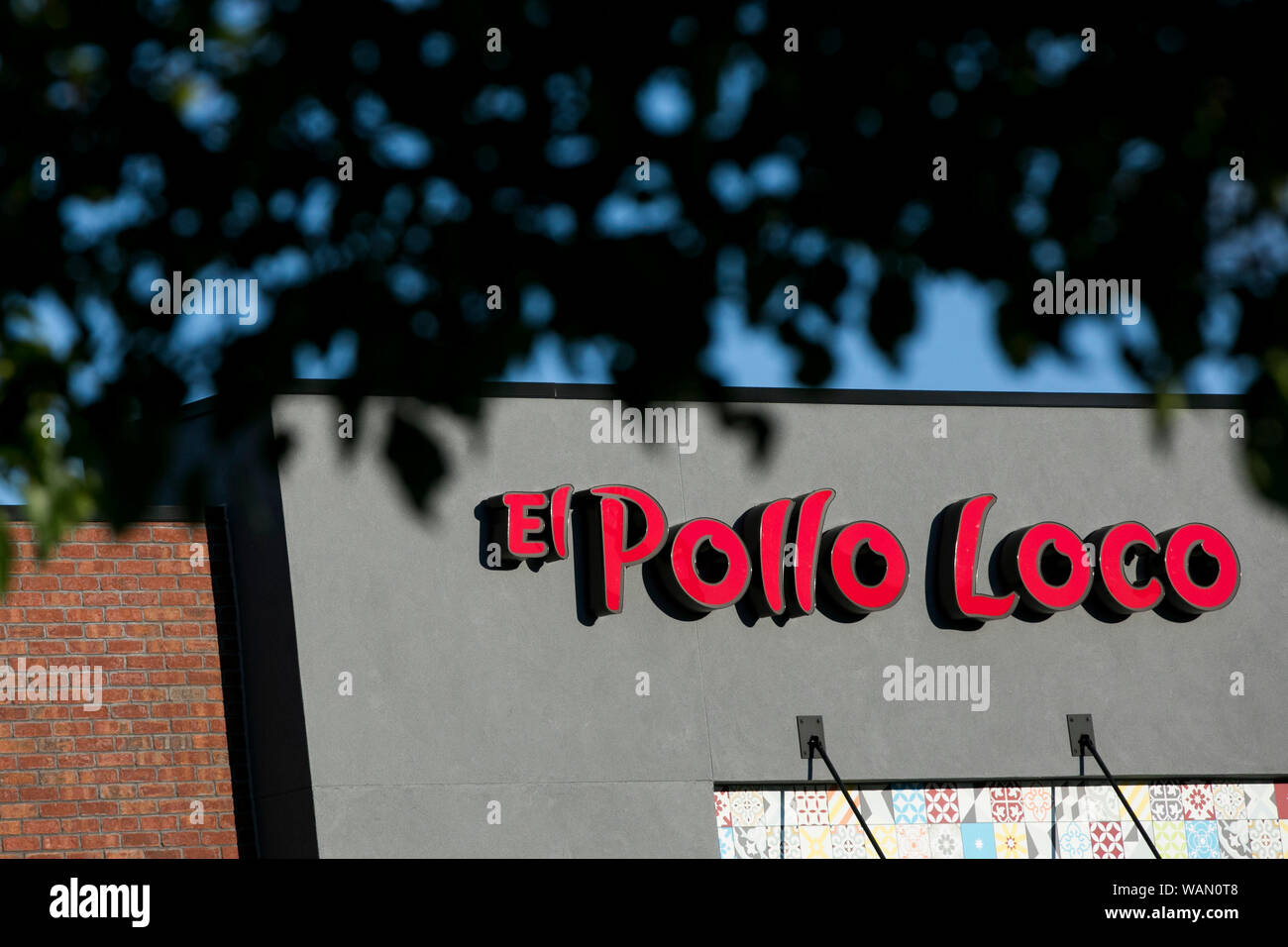 A logo sign outside of a El Pollo Loco fast food restaurant location in Orem, Utah on July 29 ...
