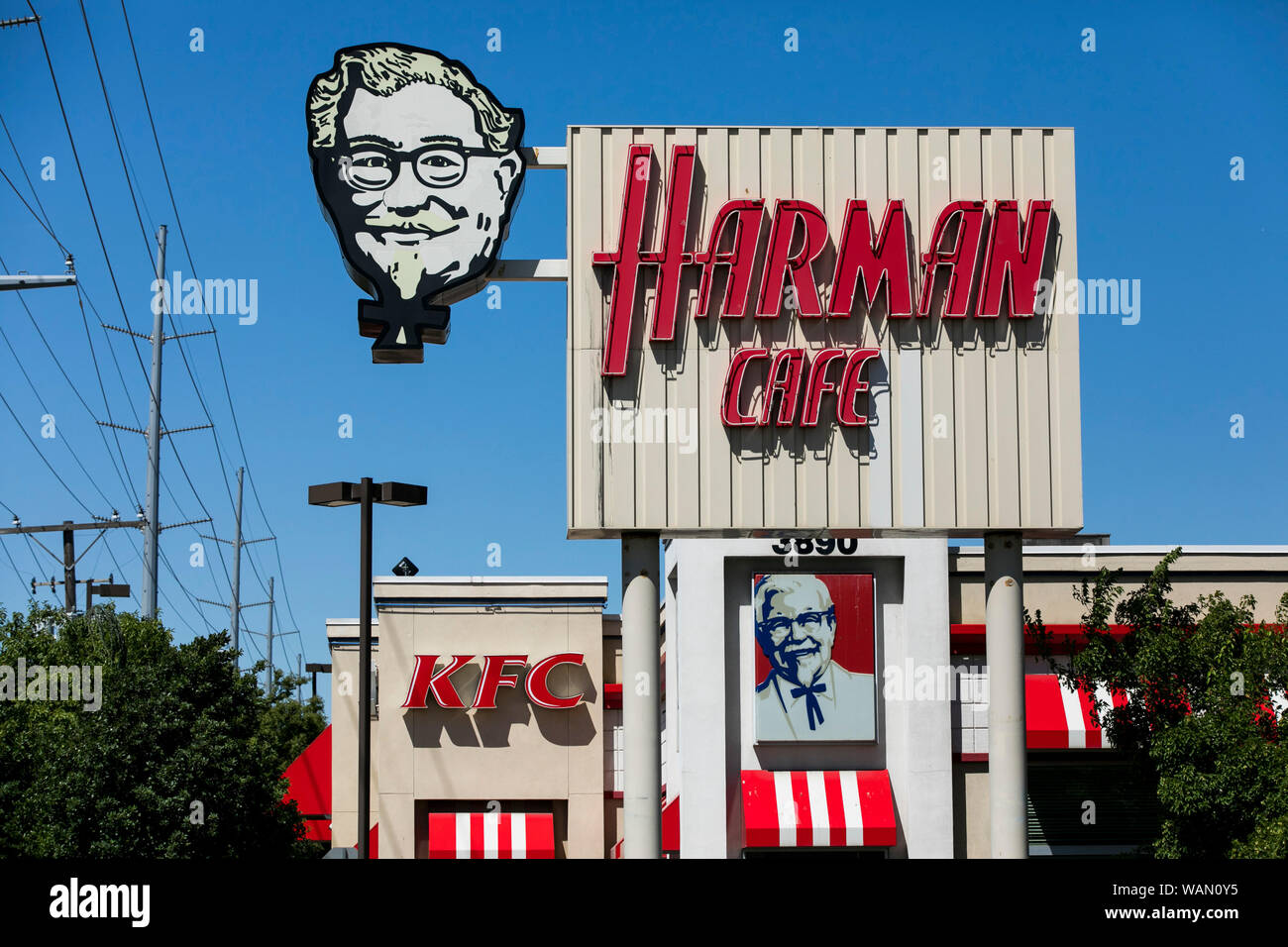A Harlan Cafe logo sign outside of the first Kentucky Fried Chicken