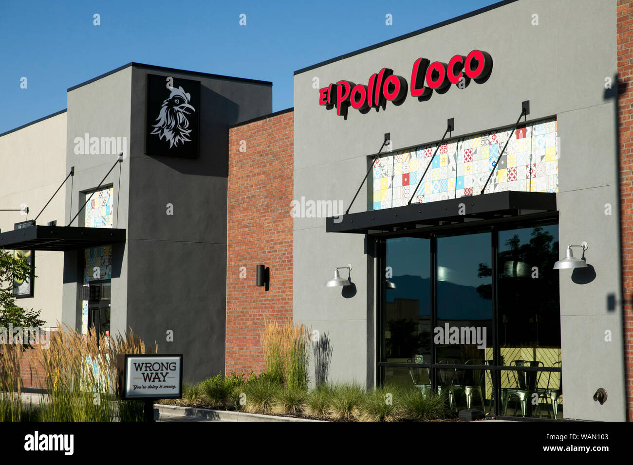 A logo sign outside of a El Pollo Loco fast food restaurant location in Orem, Utah on July 29, 2019. Stock Photo