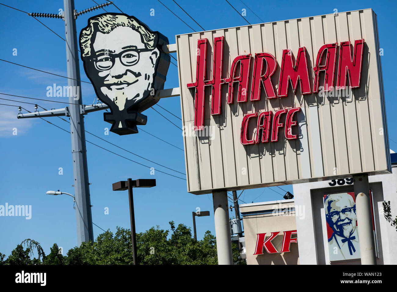 A Harlan Cafe logo sign outside of the first Kentucky Fried Chicken