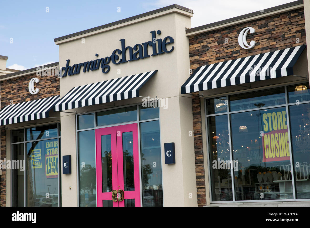 A logo and 'store closing' signs outside of a Charming Charlie retail store location in Orem, Utah on July 29, 2019. Stock Photo
