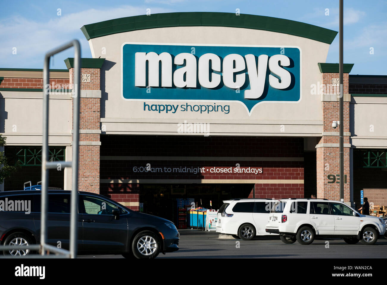 A logo sign outside of a Macey's retail grocery store location in Pleasant Grove, Utah on July