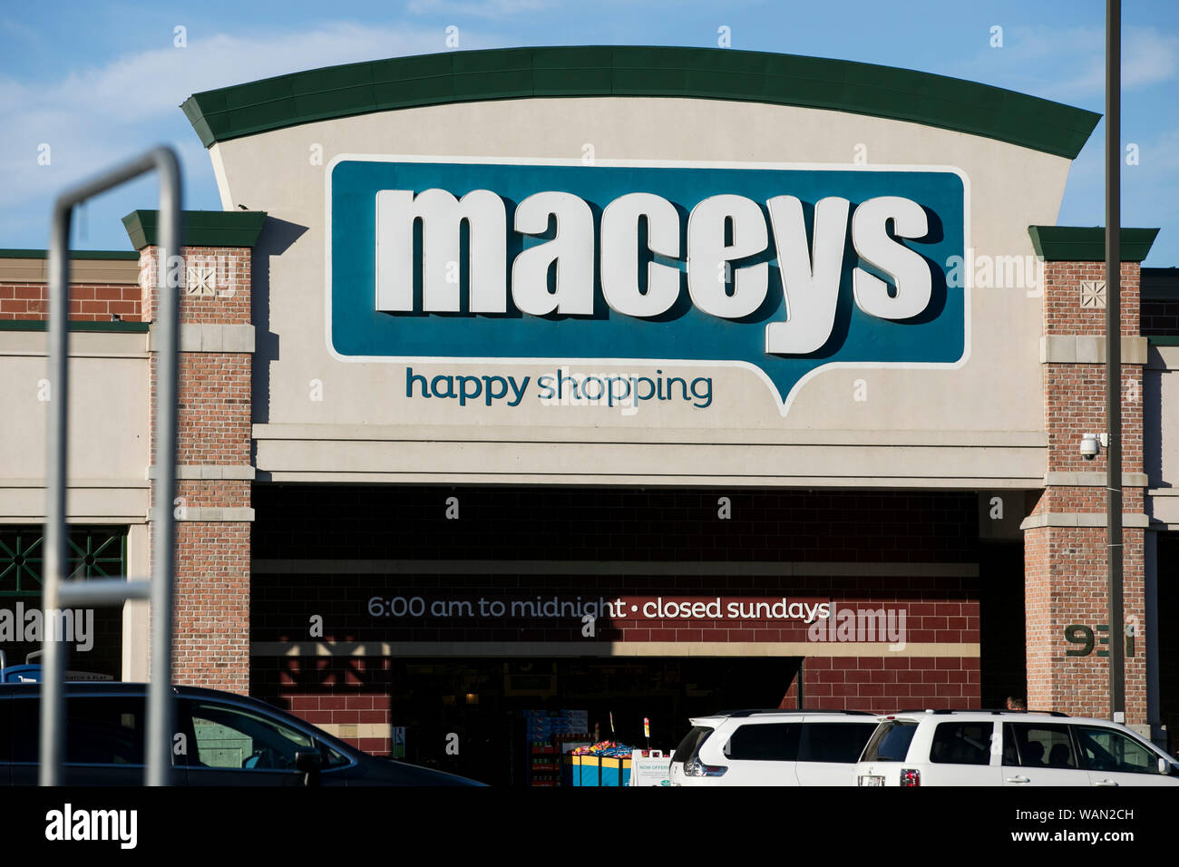 A logo sign outside of a Macey's retail grocery store location in