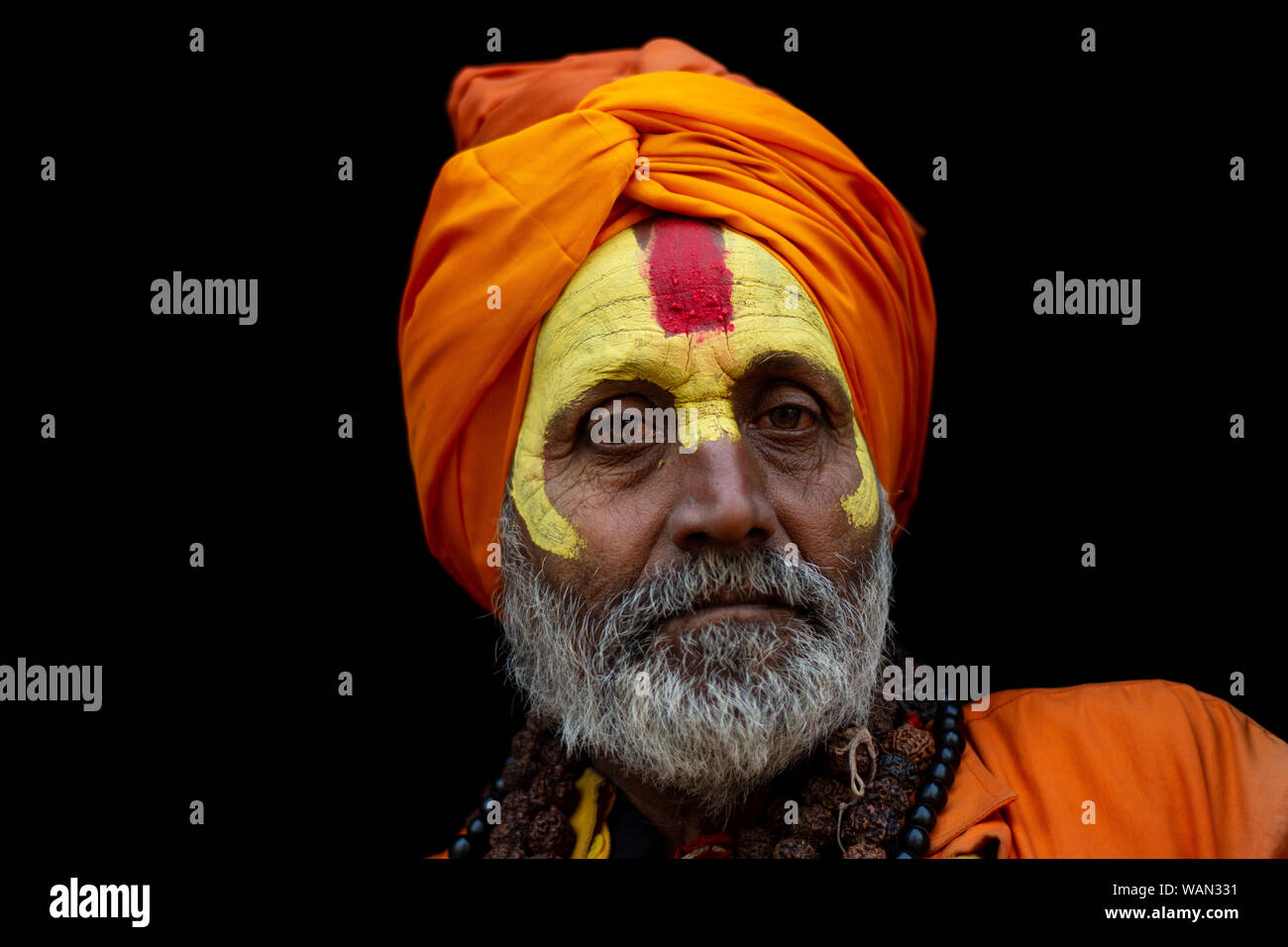 Hindu holy man poses for a photograph at the courtyard of the Pashupatinath Temple during Shivaratri. Stock Photo