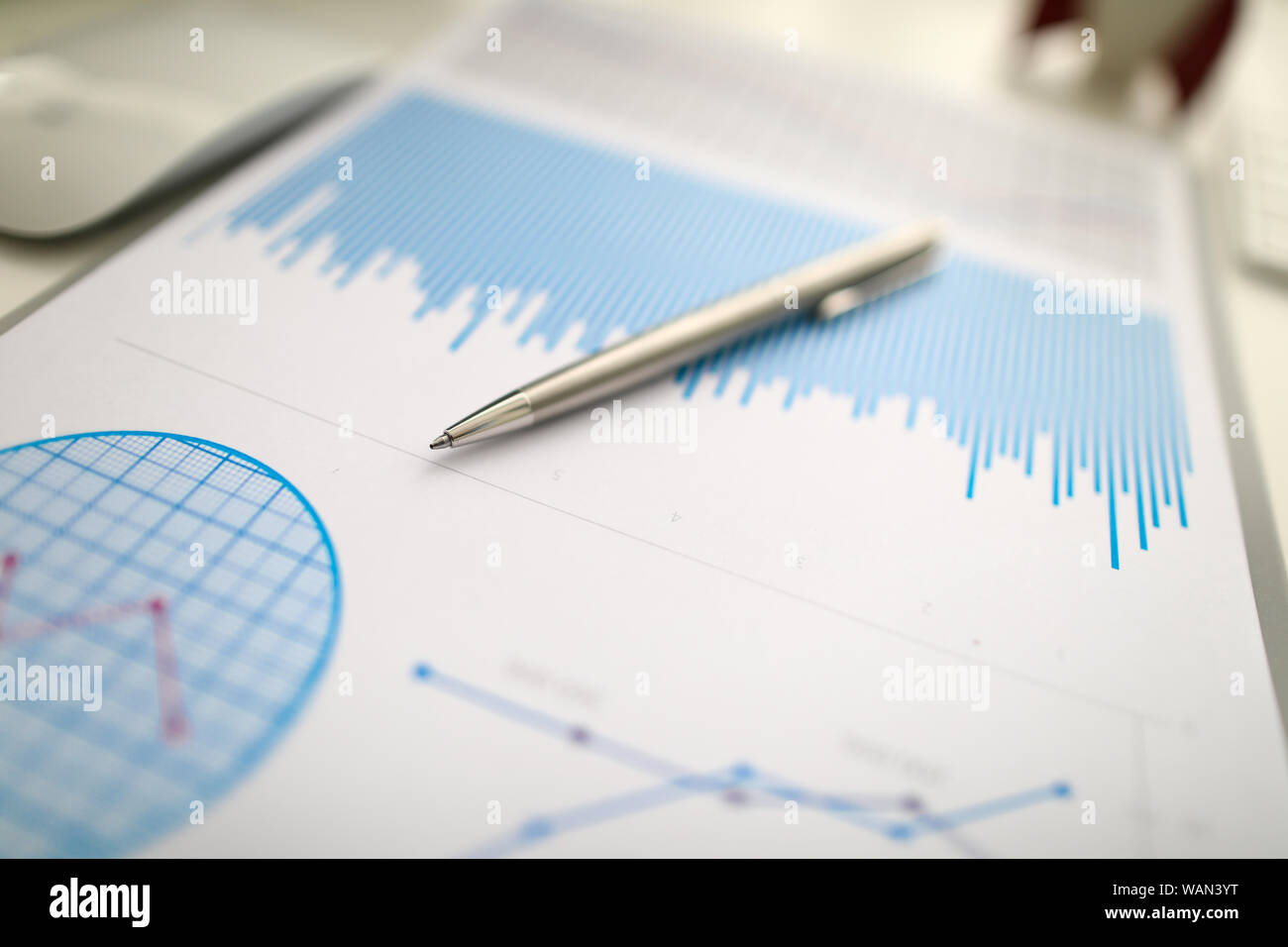 Silver pen lies on paper documents with color Stock Photo