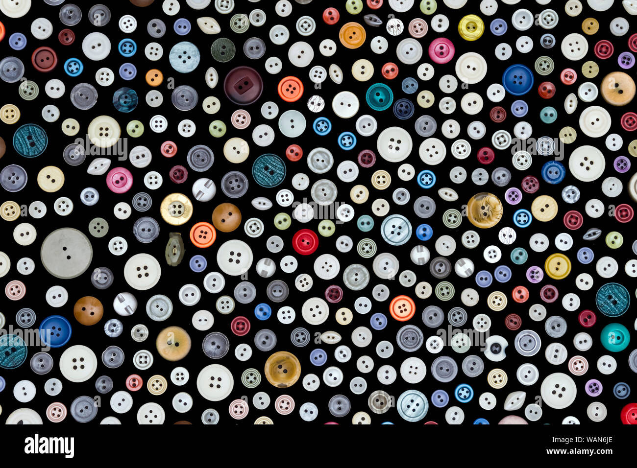 background - buttons of different colors and sizes are randomly ...