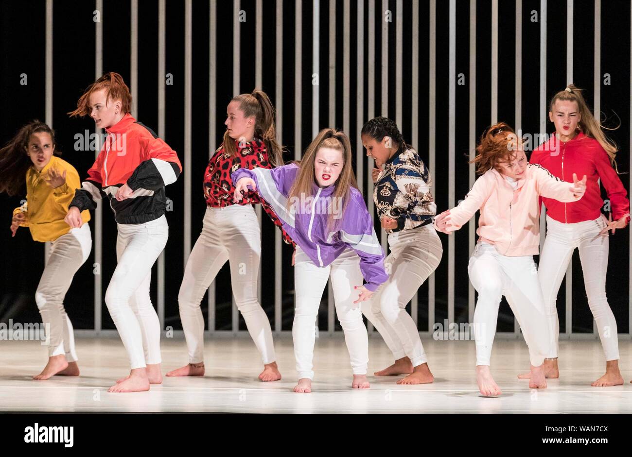 Edinburgh, Scotland, UK. 21st Aug, 2019. A dance piece which looks behind the masks of violence and machismo to the inner lives of Belfast hard men and strong women. Cast in four episodes, Hard to Be Soft features solos from Oona Doherty, a warrior-like hip-hop dance group, and a choreographed wrestling match for a male duet. Using rich, sometimes unsettling imagery from Belfast street life and religious ritual, and set inside a massive, gleaming cage, it contrasts shocking power with meditative stillness. Credit: Rich Dyson/Alamy Live News Stock Photo