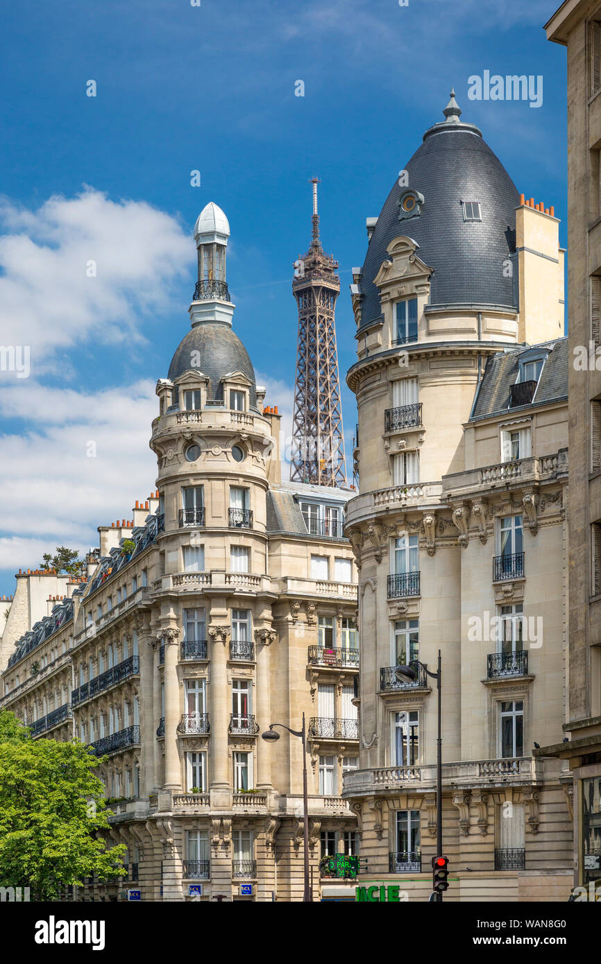 Eiffel Tower viewed through the buildings of Passy, Paris, France Stock