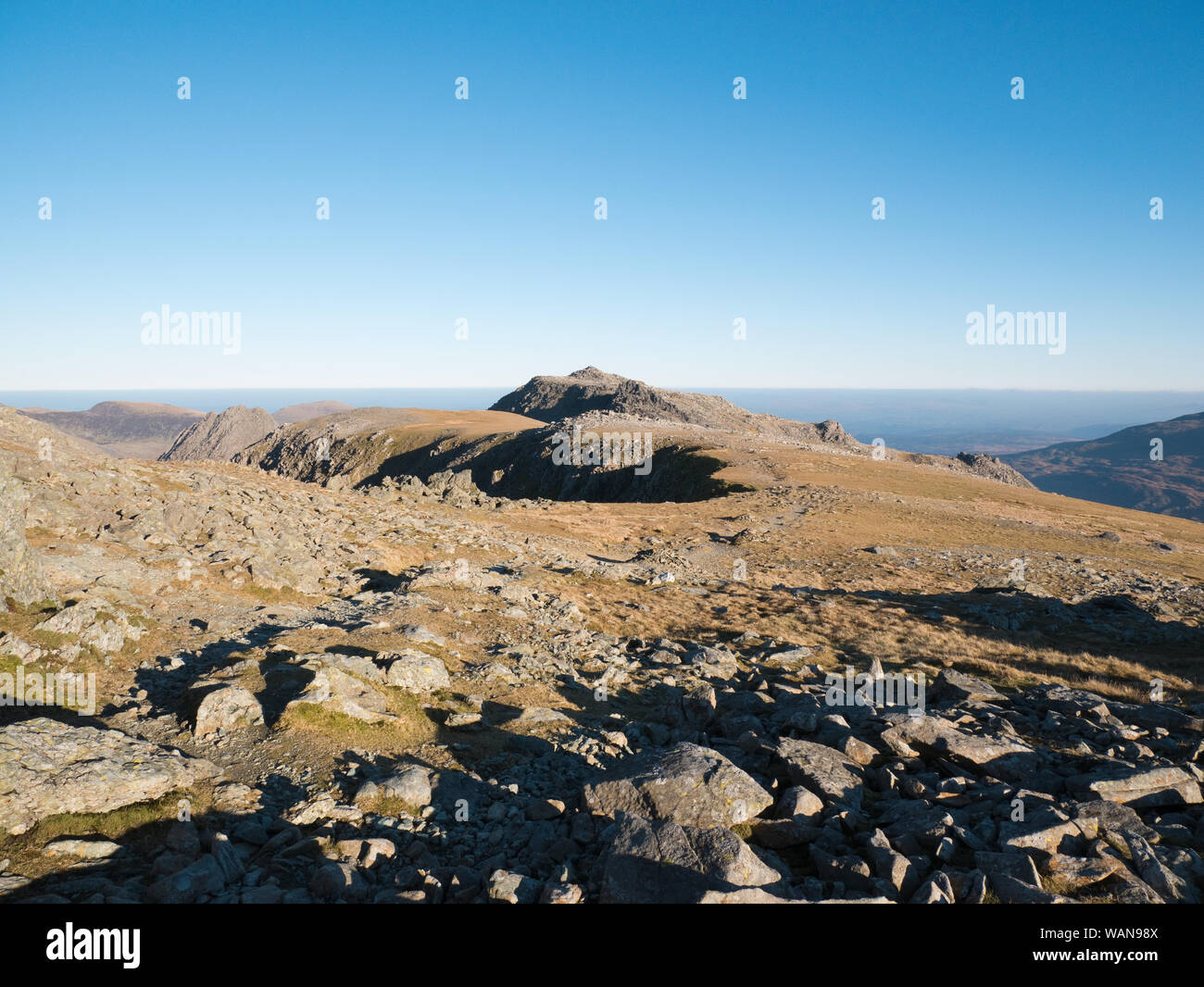 The rocky summit plateau of Y Glyderau mountains in Snowdonia, showing the summit of Glyder Fach viewed from neighbouring Glyder Fawr Stock Photo