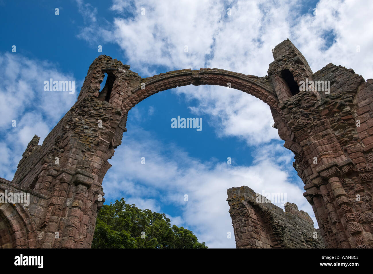 The ruins of Lindisfarne Priory on The Holy Island of Lindisfarne in Northumberland, UK Stock Photo