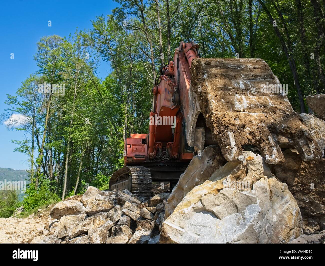 Excavator loader machine at road construction site Stock Photo
