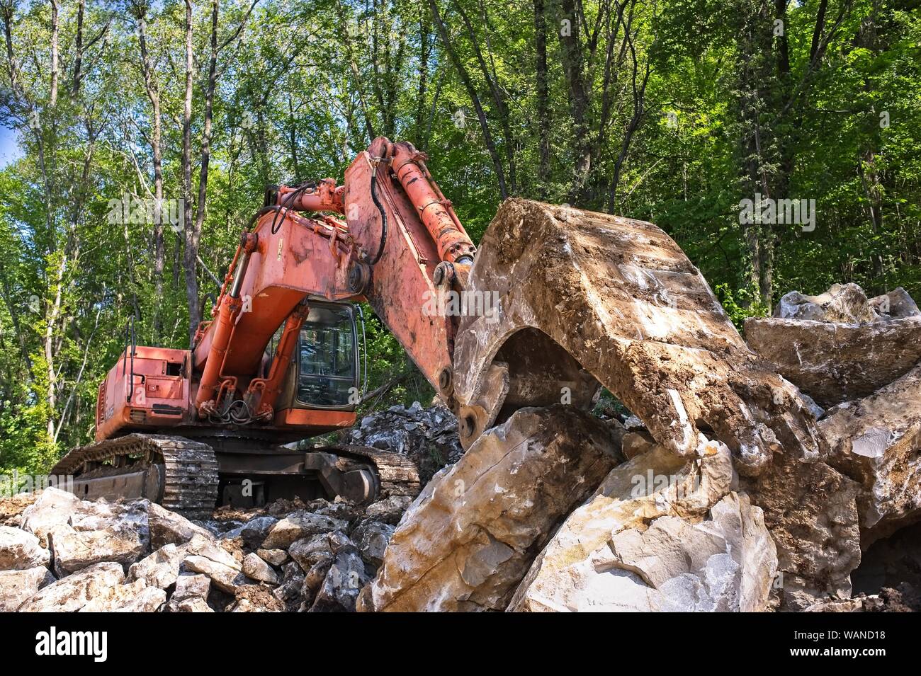 Excavator loader machine at road construction site Stock Photo