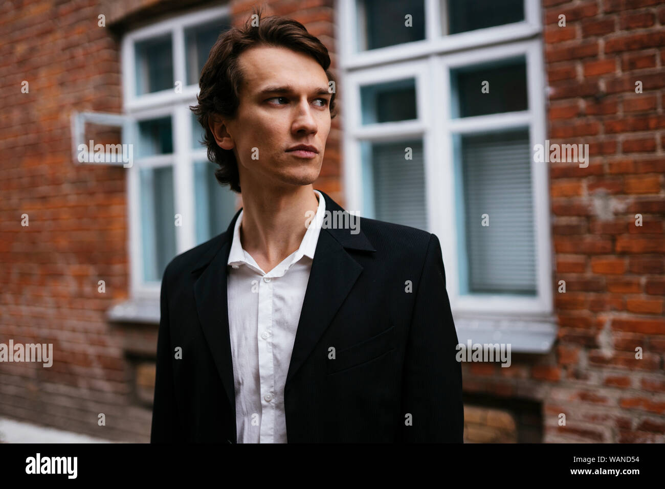 man in a business suit looks away Stock Photo