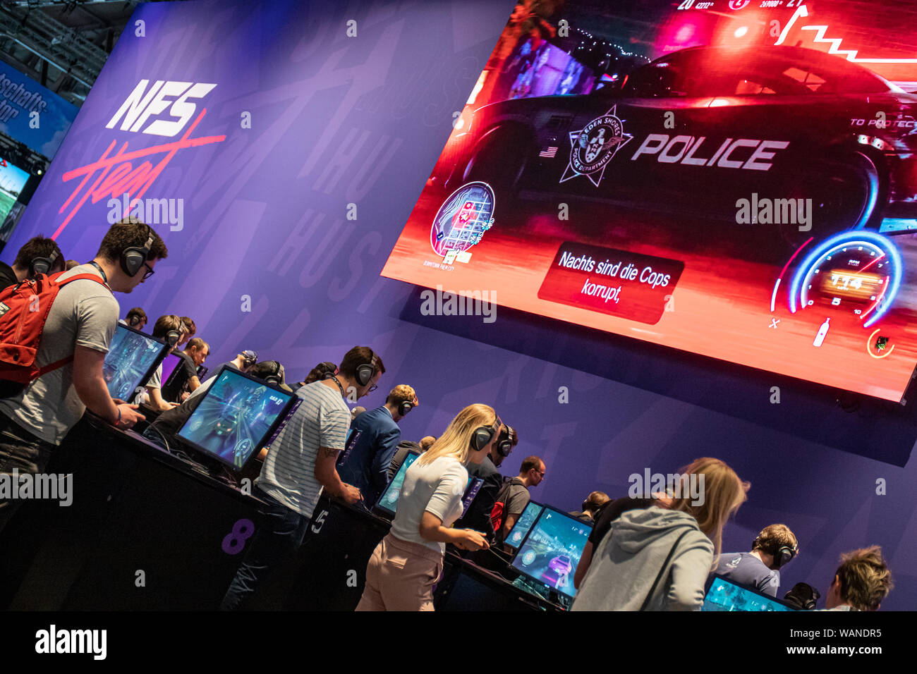 Cologne, Germany. 20th Aug, 2019. Gamescom 2019: Visitors are playing racing game Need for Speed Heat by publisher Electronic Arts. Gamescom is the world's largest trade fair for computer and video games, at Koelnmesse in Cologne, Germany, from 20th to 24th August 2019. Photocredit: Christian Lademann Stock Photo