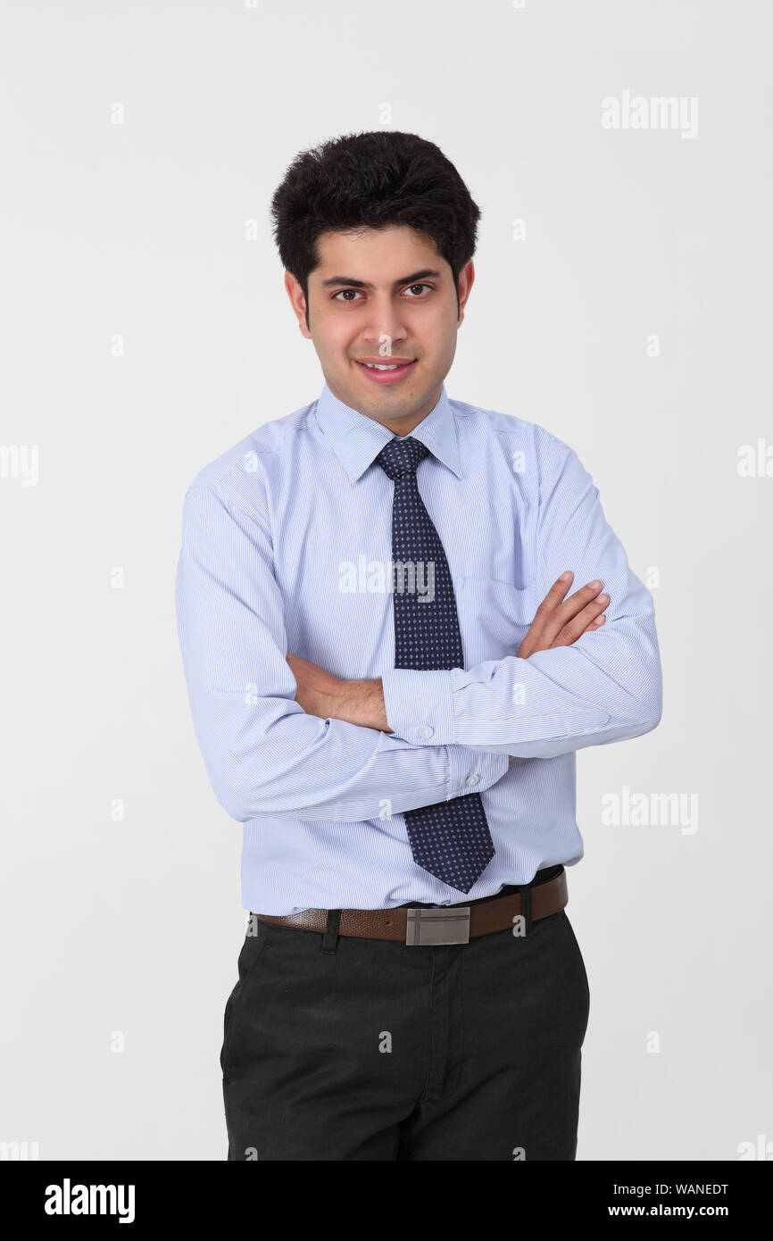 Businessman standing with his arms crossed Stock Photo
