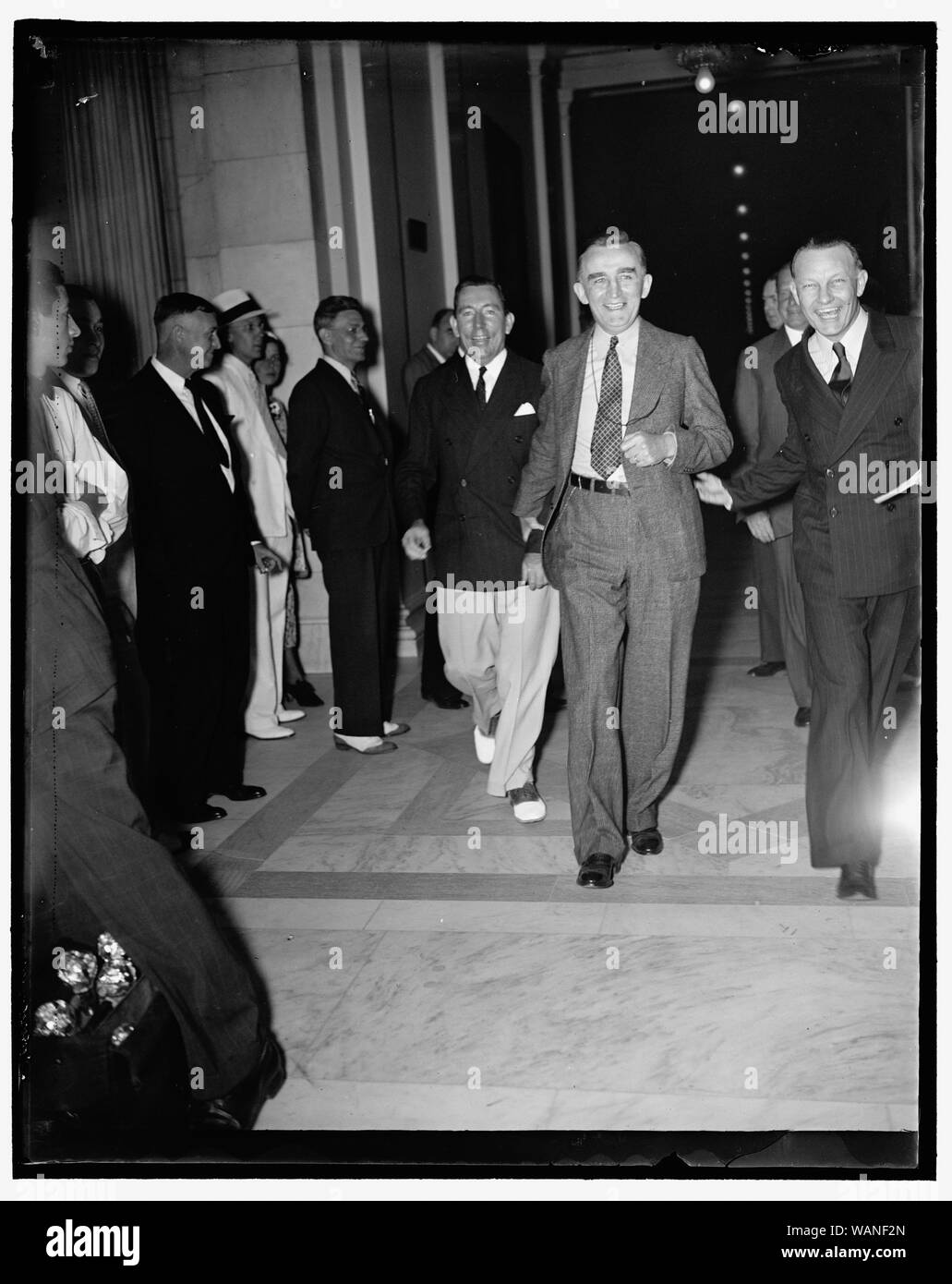 Court plan opponent. Washington D.C., July 22. Once the faired-haired boy at the White House, Senator Joseph C. O'Mahoney of Wyoming, is now bitterly opposing the President's Court Reorganization plan. He is shown leaving the extraordinary meeting of the Senate Judiciary Committee today, 7/22/37 Stock Photo