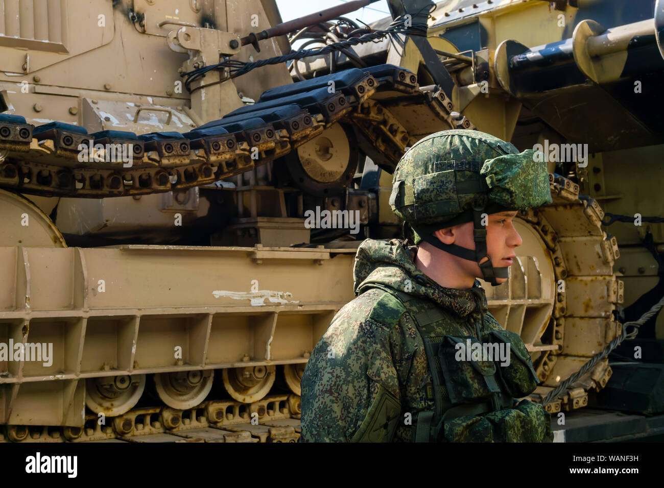 Perm, Russia - April 10, 1019: soldier guarding the mobile exhibition of trophies of the Russian army captured during the Syrian campaign Stock Photo