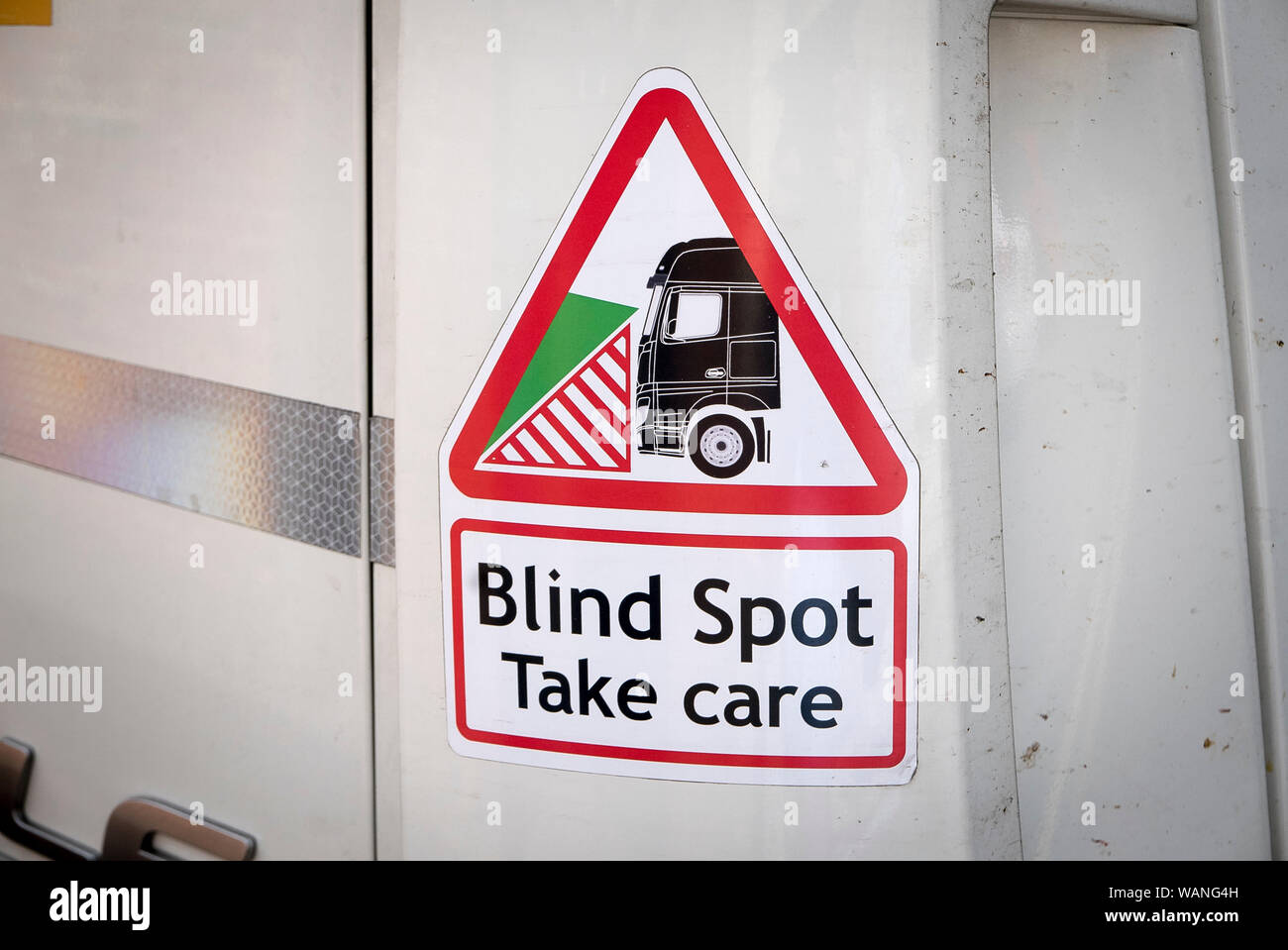Warning sign and symbol concerning limitations of truck driver's vision when manoeuvering among pedestrians in towns Stock Photo