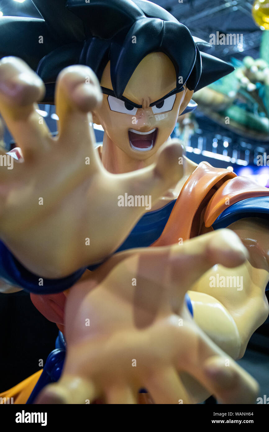 Cologne, Germany. 20th Aug, 2019. Gamescom 2019: Exhibition 'Dragon Ball World Adventure' with figures of character main protagonist Son Goku from Japanese manga franchise Drangon Ball and booth of video game publisher Bandai Namco presenting new anime-action-game Dragon Ball Z Karakot. Gamescom is the world's largest trade fair for computer and video games, at Koelnmesse in Cologne, Germany, from 20th to 24th August 2019. Photocredit: Christian Lademann Stock Photo