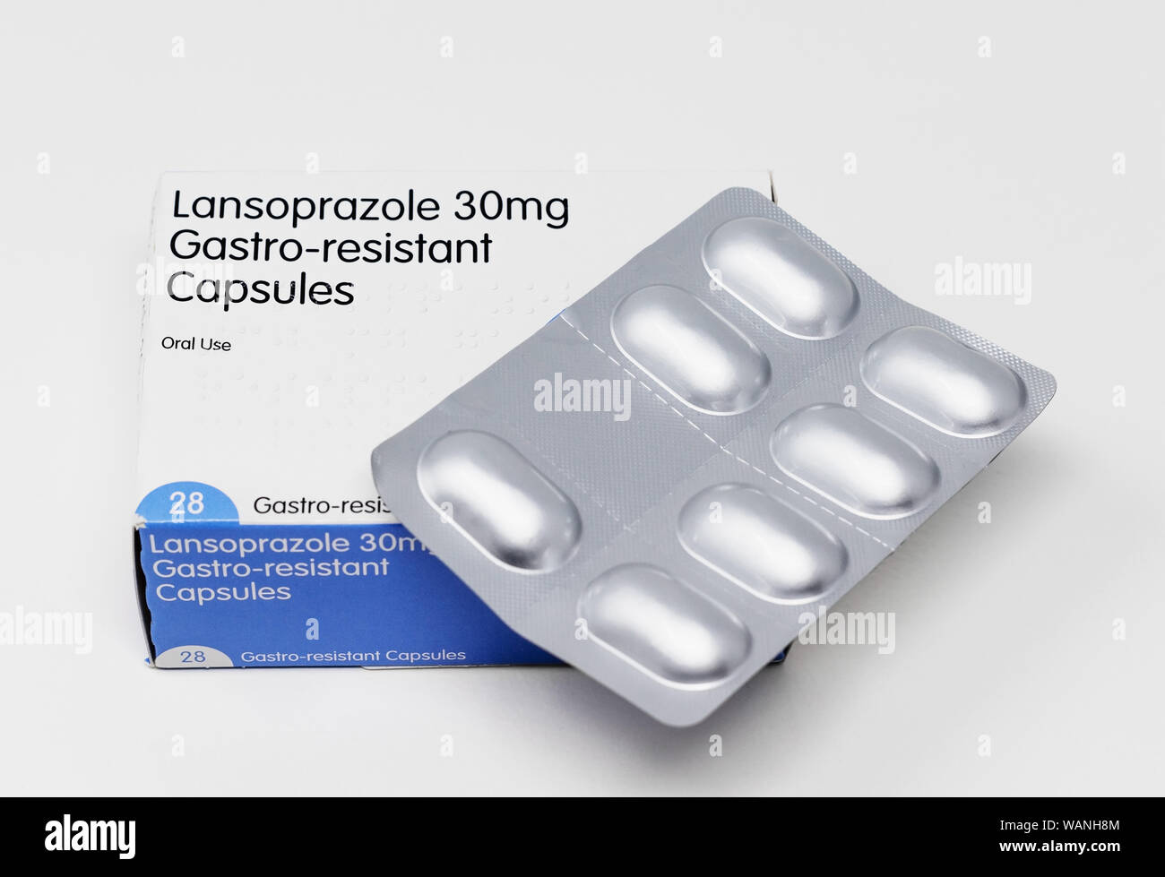 London / UK , August 17th 2019  - Box of Lansoprazole 30mg gastro-resistant capsules and blister pack, isolated on a white background Stock Photo