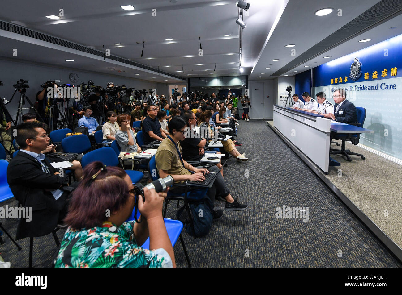 (190821) -- HONG KONG, Aug. 21, 2019 (Xinhua) -- Photo taken on Aug. 21, 2019 shows the scene of a press conference held by Hong Kong police in south China's Hong Kong. Hong Kong police on Wednesday called on all journalists to respect each other's freedom of news coverage after a female reporter from the mainland was surrounded by her Hong Kong peers questioning her identity after a press conference on Tuesday. The police have existing measures to effectively verify reporters' identity, consistent with that of other press conferences of the Hong Kong Special Administrative Region (HKSAR) g Stock Photo