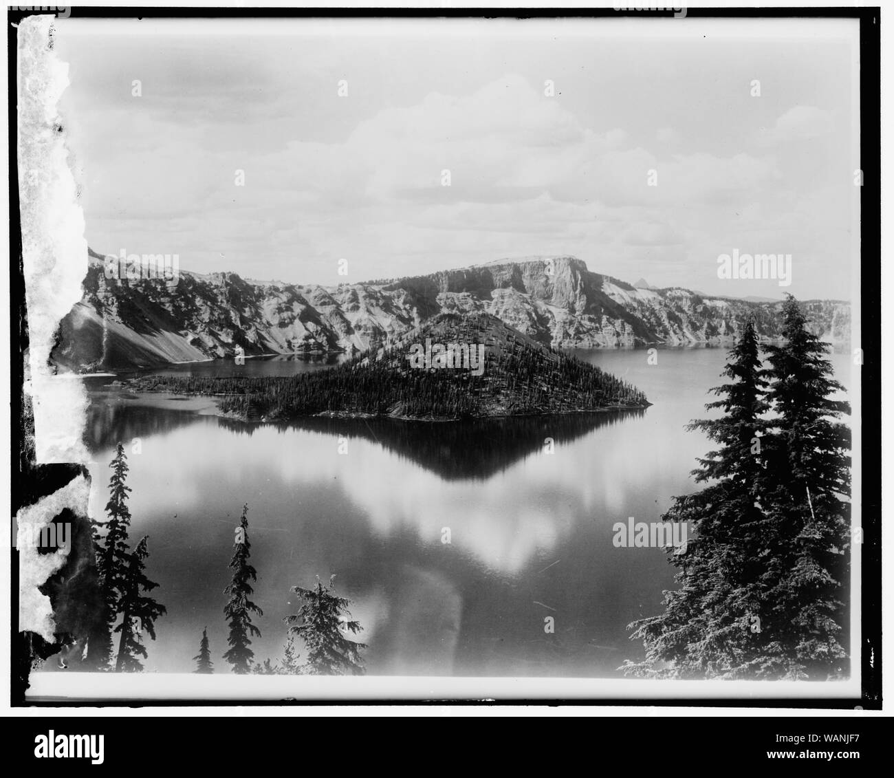 Crater Lake. This view of Crater Lake in Southern Oregon was taken from a United Air Lines' transport plane flying on the San Diego-Seattle airway, 6/9/36 Stock Photo