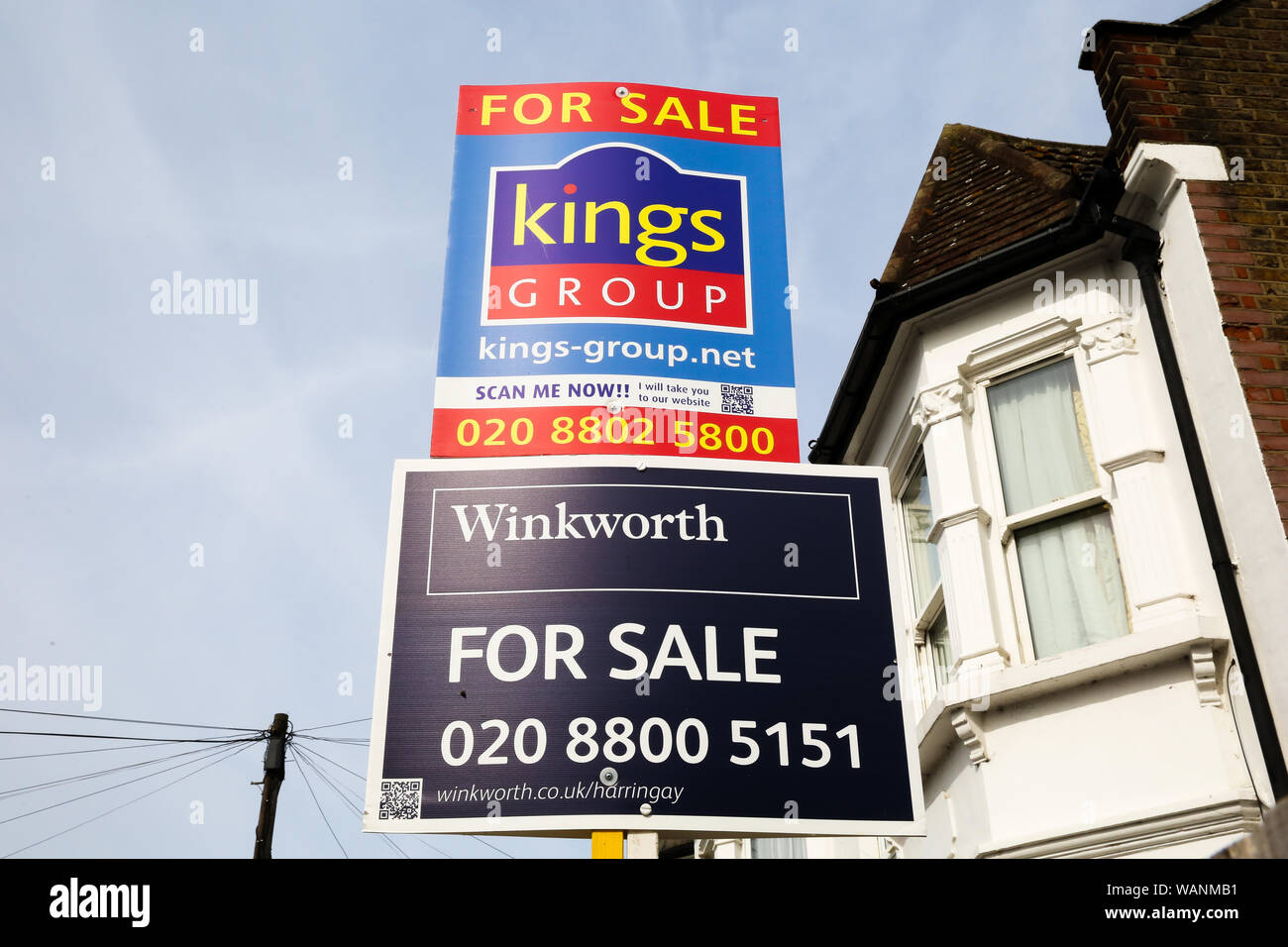 Estate agents property for sale boards on display outside a residential property in north London. The number of house sales increased in August 2019 according to Rightmove, up 6.1% a year earlier. Stock Photo
