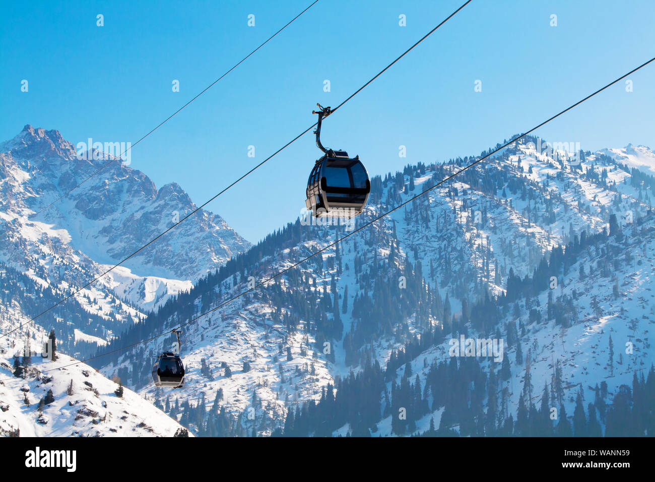 Almaty, Kazakhstan ski lift, gondola cable car at Medeo to Shymbulak against mountain background Stock Photo