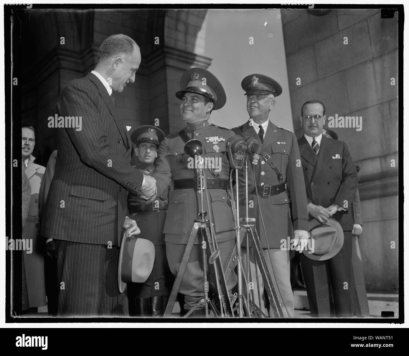 Cuba's Dictator greeted upon arrival. Washington, D.C., Nov. 10. Sumner Wells, The Undersecretary of State, shown shaking hands with Col. Fulgencio Batista as Gen. Malin Craig, the Chief of Staff of the U.S. Army looks on, 11/10/38 Stock Photo