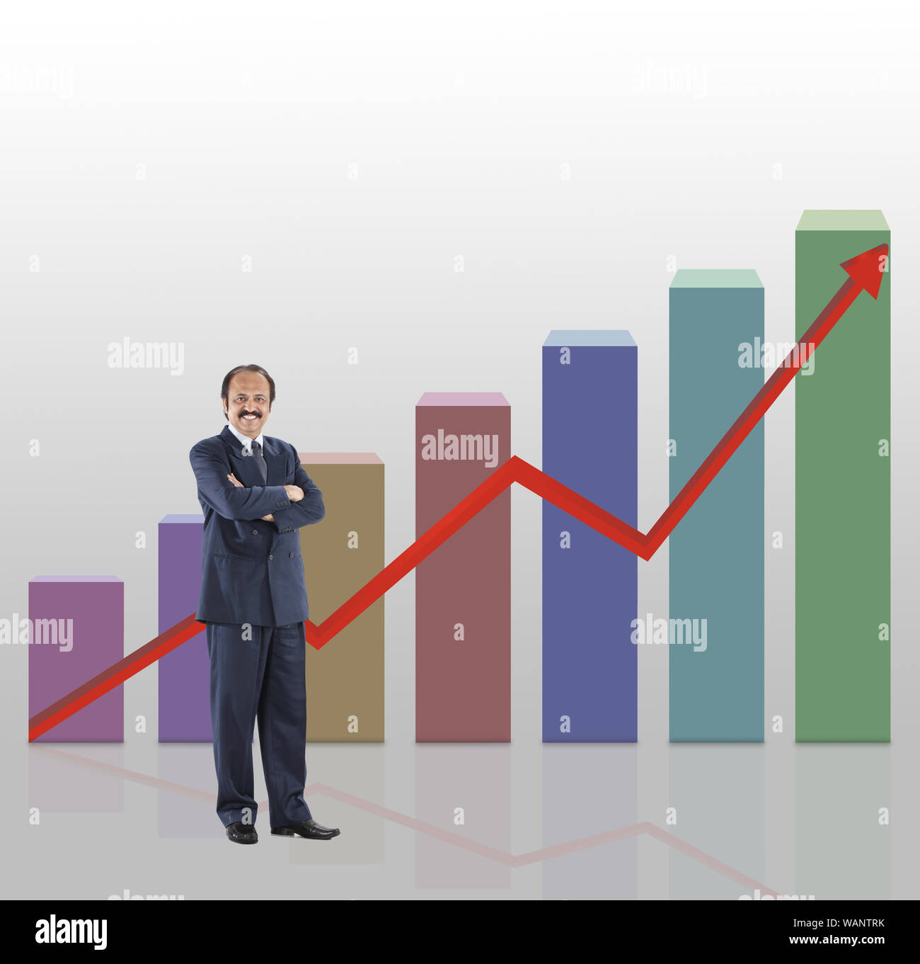 Businessman standing in front of bar graph rising upward Stock Photo ...