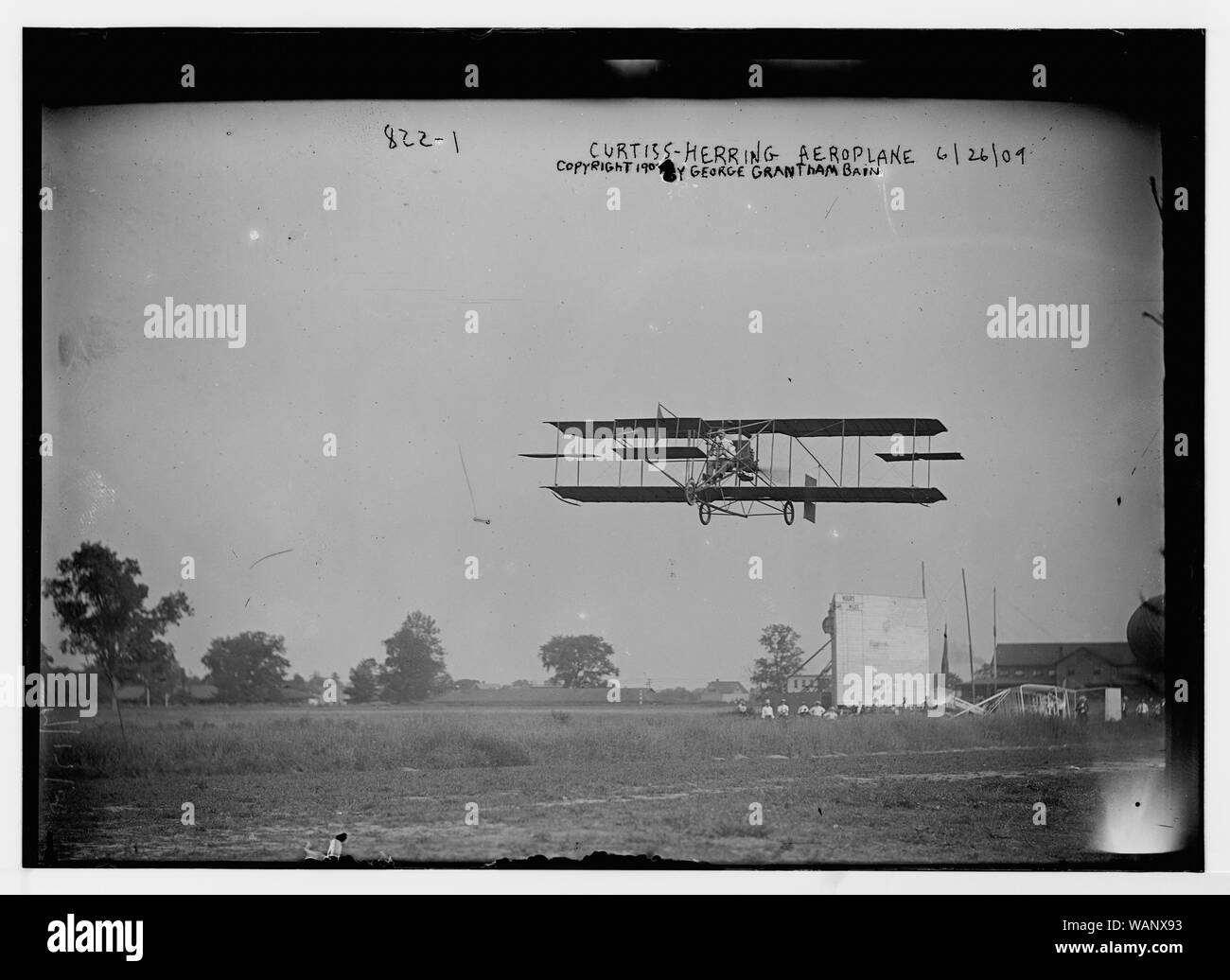 CurtissHerring aeroplane, in fligh over field Stock Photo Alamy