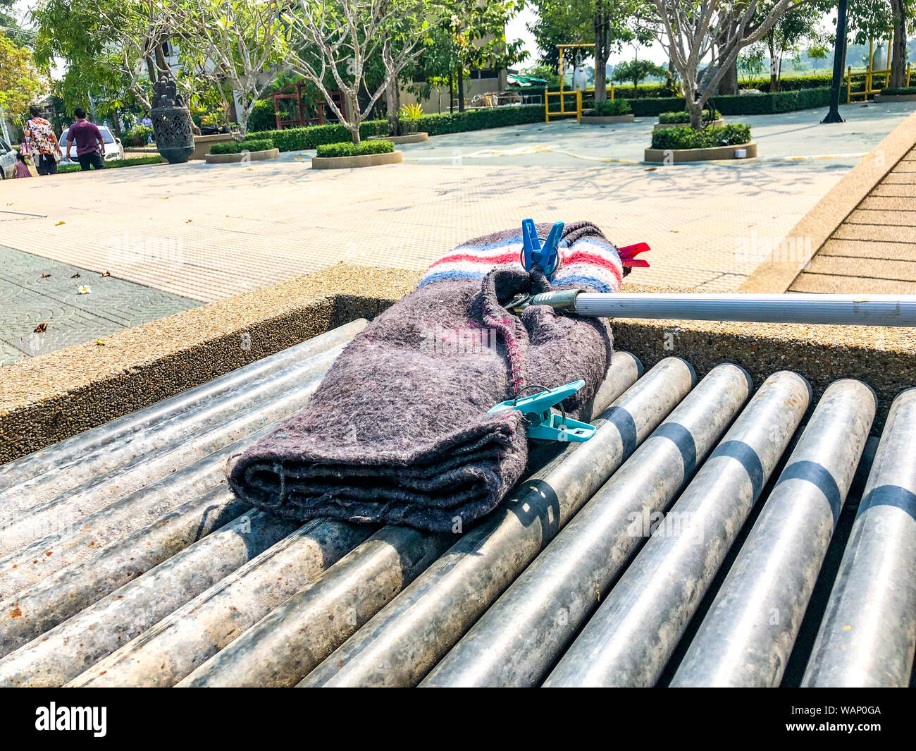 mop stick with the mop cloth are dried on the rolling steel Stock Photo