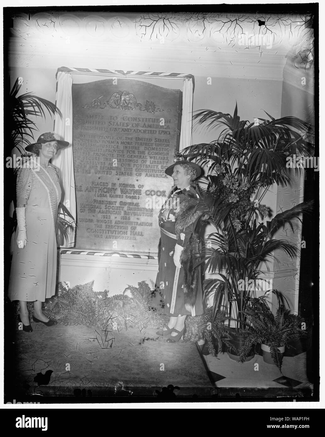 D.A.R. honors Mrs. Anthony Wayne Cook. Washington, D.C., April 17. A bronze tablet inscribed with the preamble to the Constitution was unveiled at the D.A.R. Constitution Hall in honor of Mrs. Anthony Wayne Cook, of Cooksburg, Pa. Mrs. Cook was President General of the D.A.R. from 1925 to 1926 and is now honorary President General. The Hall was built during her administration. Left to right at the unveiling are: Mrs. William A. Becker; President General who accepted the tablet; and Mrs. Harper D. Sheppard of Pa., who unveiled the memorial, 4/17/1937 Stock Photo