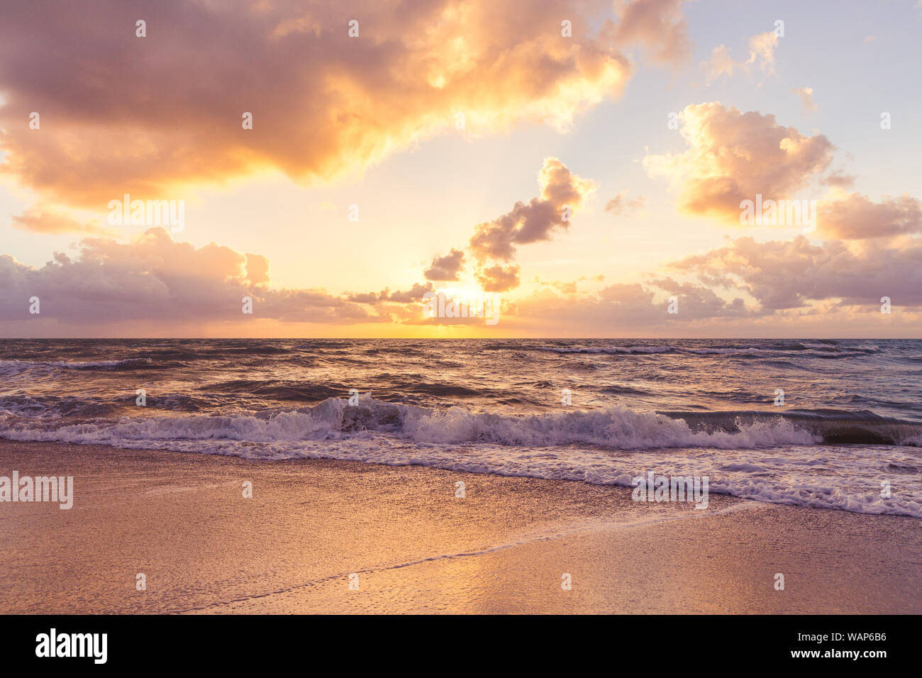 Cloud coastline background. Fiery orange sunset sky. Amazing sunrise on the  beach in Miami Stock Photo - Alamy, image size:1300x956