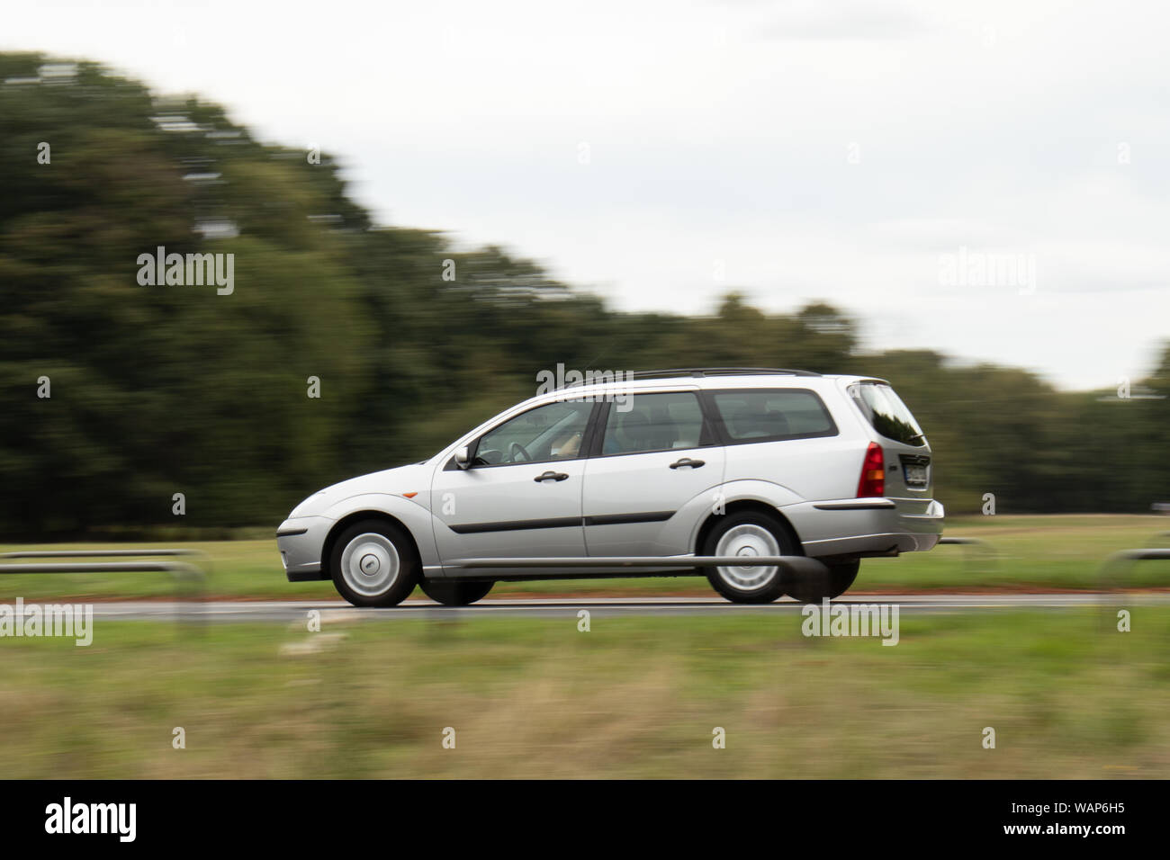 car in motion, blurred background, Ford Focus Stock Photo
